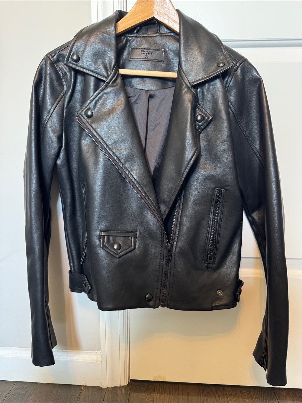 Blank NYC Black Leather Moto Jacket with Zip Pocket Details